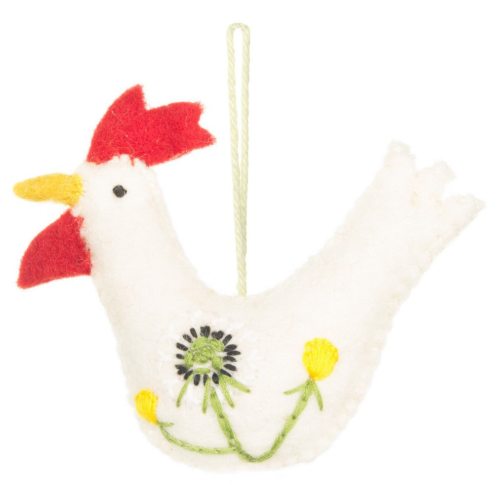 Detailfoto van vilten hanger haan met paardenbloem