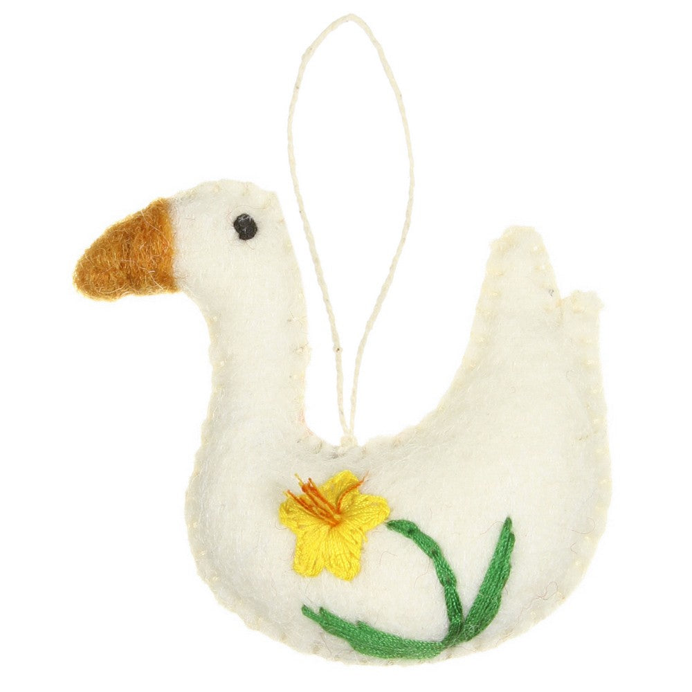 Detailfoto van vilten hanger gans met narcis