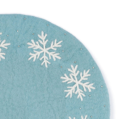 Detailfoto van onderzetter 35 cm ijsblauw sneeuwvlok van vilt