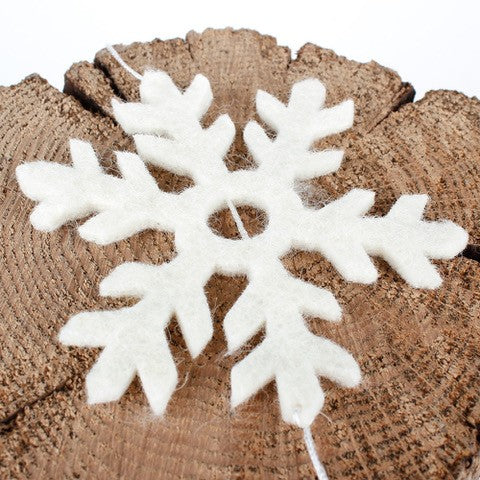 Detailfoto van vilten viltslinger sneeuwvlok
