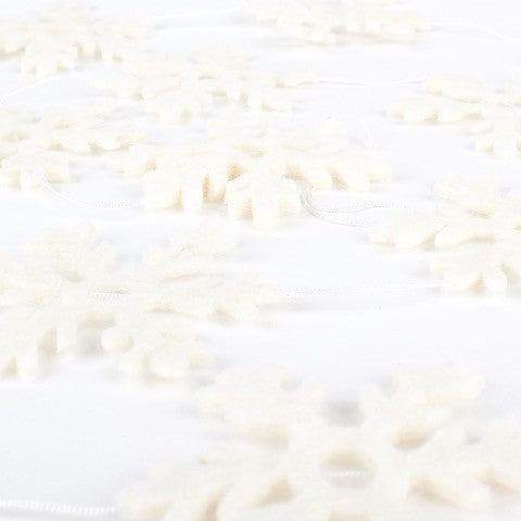 Detailfoto van vilten viltslinger sneeuwvlok